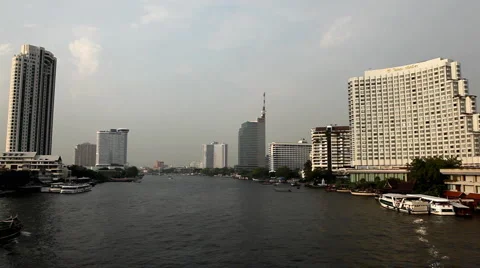 Skyline, Chao Phraya River in Bangkok, Thailand, View from Taksin Bridge, Boats Stock Footage