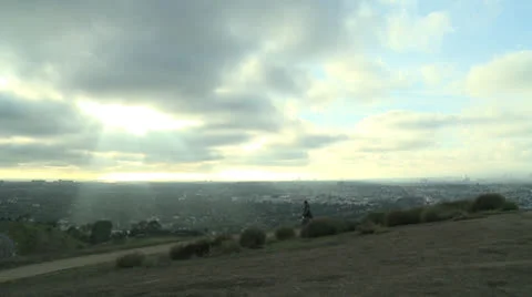 Skyline couple walks Stock Footage 24203200