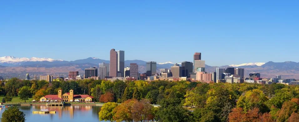 Skyline of Denver downtown with Rocky Mountains Stock Photos