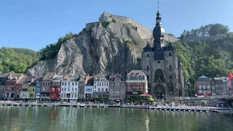 Skyline of Dinant city. People movement at riverfront. Dinant,  Belgium Stock Footage