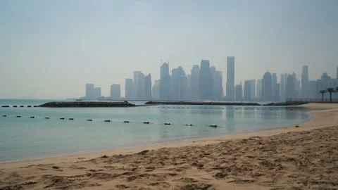 The Skyline of Doha, Qatar, from the sea, with reflections on the water Stock-Footage 150958758