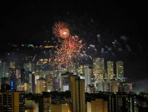 Skyline Glows Softly Tonight, Subtle Luminous Displays Dance Above Quiet Urban Stock Photos