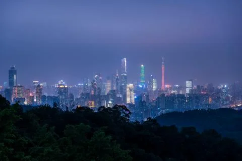 The skyline of Guangzhou city at night in China,shot from the summit of Mount Stock Photos