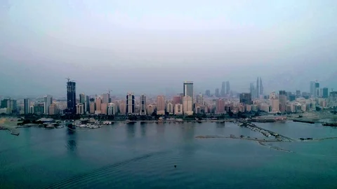 The skyline of Manama Bahrain via drone flight Stock Footage