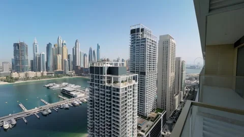 Skyline perspective of Palm Jumeirah captured from Emaar Beachfront in DUbai Stock Footage 336037154