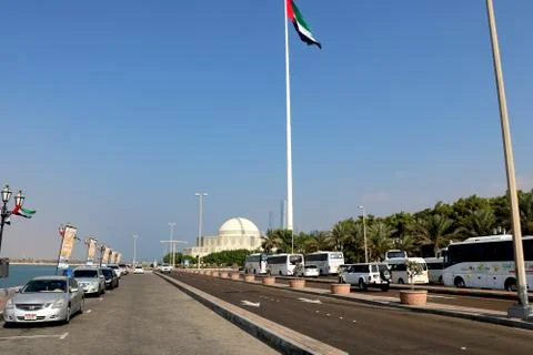 A skyline view of the Abu Dhabi including the UAE National Flag Stock Photos