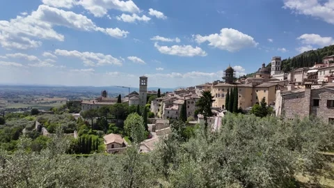 Skyline view of Assisi with domes and olive groves in Umbria Italy Stock Footage 338009130
