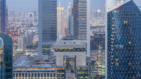 Skyline view of the buildings of Sheikh Zayed Road and DIFC day to night Stock Footage 90631095
