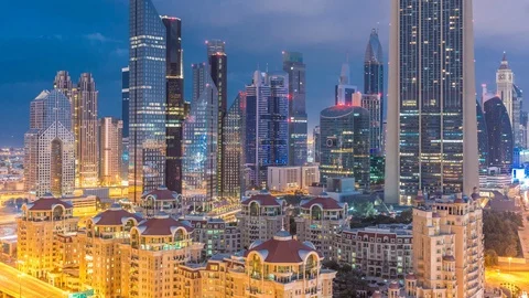 Skyline view of the buildings of Sheikh Zayed Road and DIFC night to day Vídeos de archivo 110834866