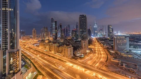 Skyline view of the buildings of Sheikh Zayed Road and DIFC night to day Stock Footage 110839694
