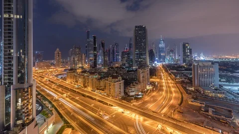 Skyline view of the buildings of Sheikh Zayed Road and DIFC night to day Stock Footage 114070112