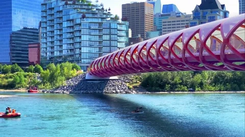 Skyline view of the peace bridge in Calgary downtown during a sunny day of summe Stock Footage 208228211