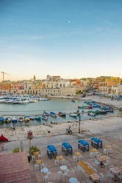 Skyline view of seafront and old town Bisceglie in Puglia on sunset. Stock Photos