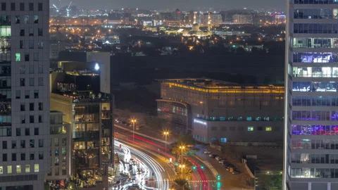 Skyline view of traffic on Al Saada street near DIFC district night timelapse in Stock Footage 210528752