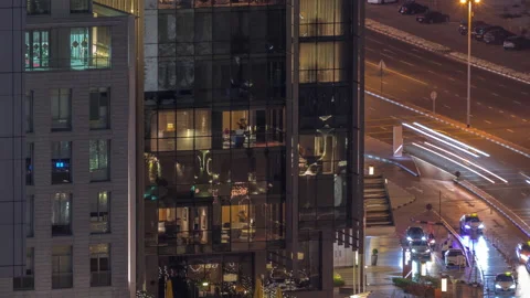 Skyline view of traffic on Al Saada street near DIFC district night timelapse in Stock Footage 229275618