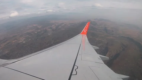 Skype Airlines. Boeing wing over Georgia, Caucasus, flight, sky. Stock Footage 296537654