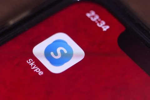 Skype mobile application on smartphone screen Stock Photos