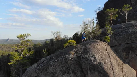 Skyrunner runs on the mountain. Stock Footage 110813315
