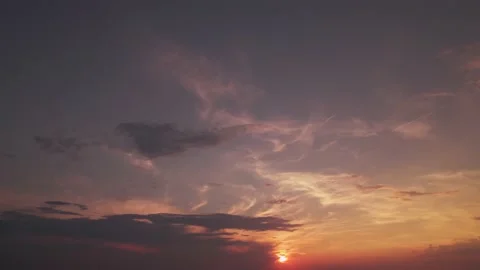 Skyscape colored with sunrays. Cloudy flight at sundown. Bird's eye view at Stock Footage 161063681