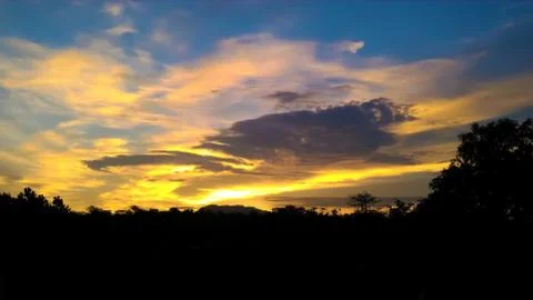 Skyscape view of sun set with cloud Stock Photos