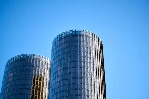A skyscraper against a blue sky with clouds Foto stock
