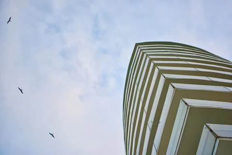 Skyscraper against the sky. Bottom view. Cancun. Stock Photos