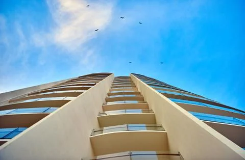 Skyscraper against the sky. Bottom view. Cancun. Stock Photos