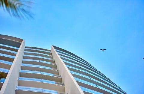 Skyscraper against the sky. Bottom view. Cancun. Stock Photos