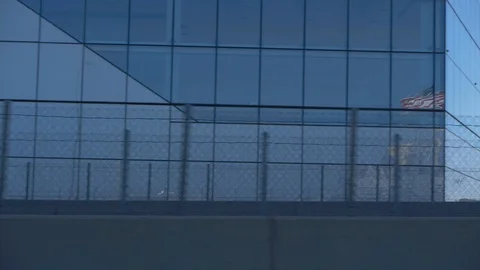 Skyscraper with American Flag Reflected in Window Glass Parallax Shot Stock-Footage 92391672
