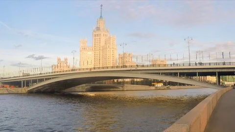 Skyscraper and bridge over the river on a summer day Stock Footage 82368601