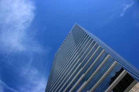 Skyscraper and clouds Stock Photos