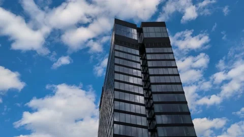 Skyscraper and clouds time-lapse Stock Footage 235617377