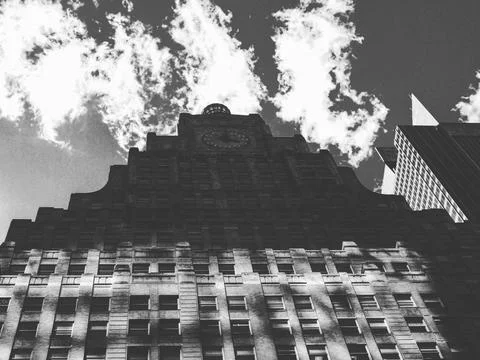 Skyscraper and reflected clouds Stock Photos