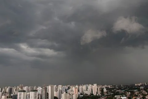 The skyscraper on the background of a rainy cloud. Sao Paulo city Brazil. Stock Photos
