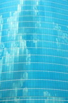 Skyscraper blue glass reflection cloud on sky Stock Photos