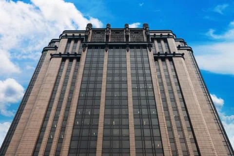 Skyscraper with blue sky and clouds on background Stock Photos