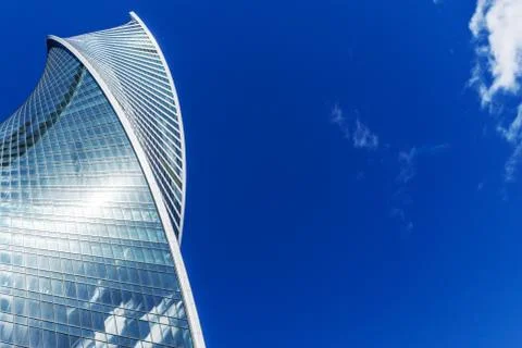 Skyscraper on blue sky Stock Photos