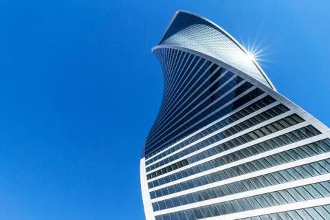 Skyscraper on blue sky Stock Photos