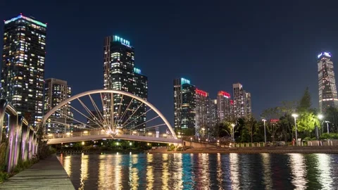 Skyscraper building with bridge illumination on songdo river in central par.. Video stock 277401388