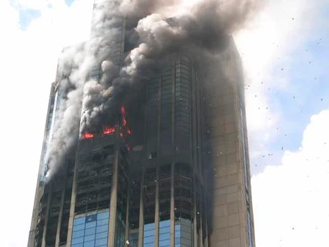 Skyscraper building on fire Stock Photos
