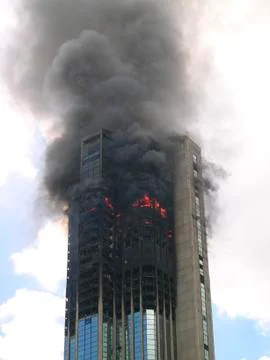 Skyscraper building on fire Stock Photos