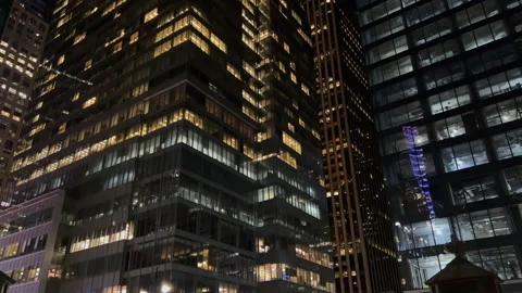 Skyscraper building at night. Light in the windows, evening city. New York. Stock Footage 168676858