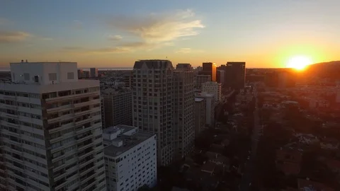 Skyscraper city skyline to sunset with beach view drone Stock Footage 86253403