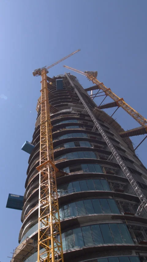 Skyscraper construction in Dubai with cranes Stock Footage 341801049