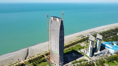 Skyscraper construction by the sea Stock Footage 168622905