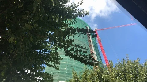 Skyscraper Construction Site Behind The Trees Stock Footage 103100949