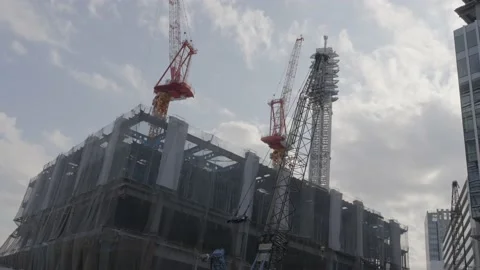Skyscraper construction site clouds pass by Stock Footage 228753866