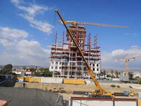 Skyscraper Construction Site with Cranes Stock Photos