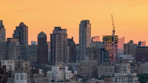 Skyscraper Crane Day to Night Timelapse Zoom Out Stock Footage 248379894