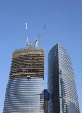 Skyscraper develop on sky background Stock Photos